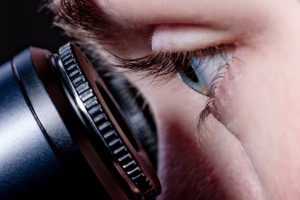 eye of scientist and microscope